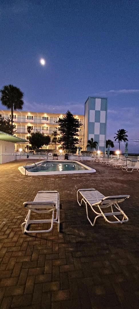 1801 South Surf Road, Unit 2E Hollywood, FL 33019 - Photo 24 of 24 a view of a patio with a table and chairs