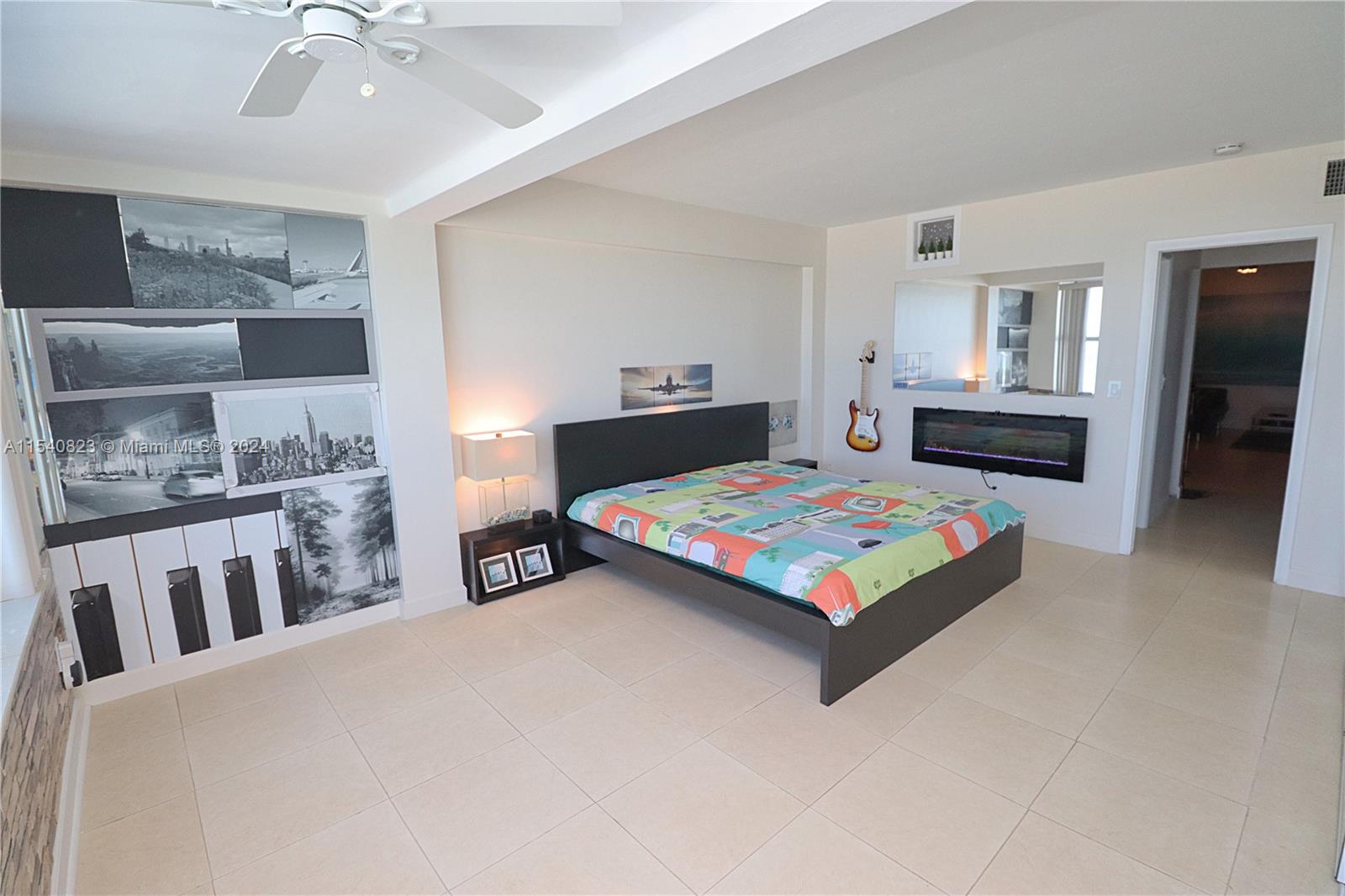 1801 South Surf Road, Unit 2E Hollywood, FL 33019 - Photo 10 of 24 a bed sitting in a bedroom and kitchen view