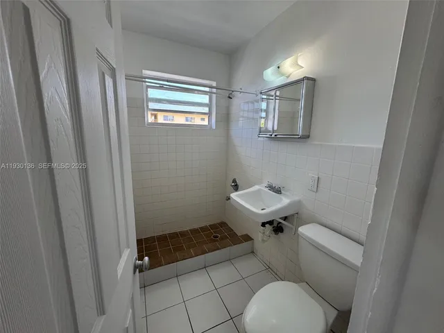 a bathroom with a sink and a toilet