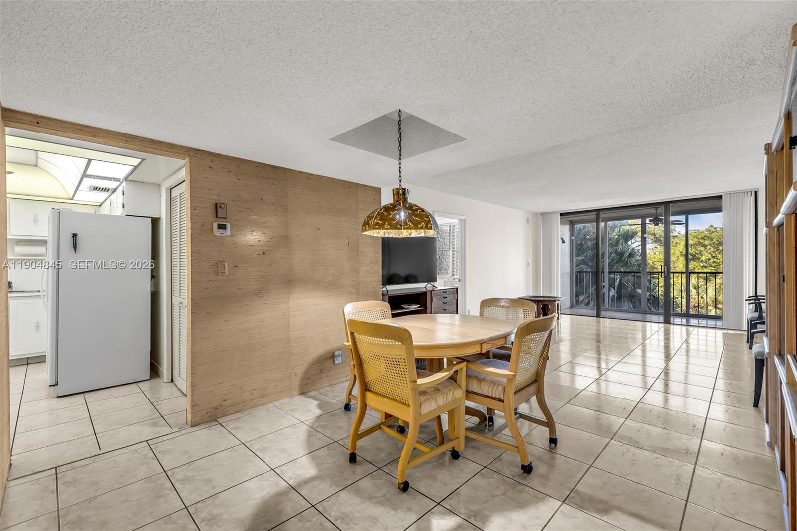16300 Golf Club Road, Unit 408 Weston, FL 33326 - Photo 12 of 31 a dining room with furniture and wooden floor