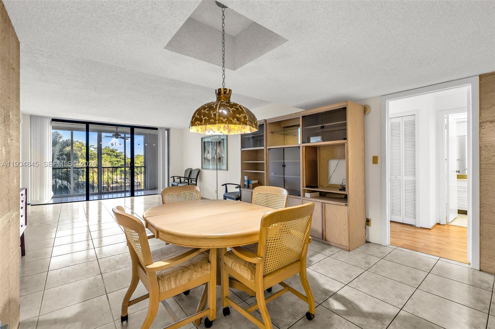 16300 Golf Club Road, Unit 408 Weston, FL 33326 - Photo 13 of 31 a view of a dining room with furniture window and outside view