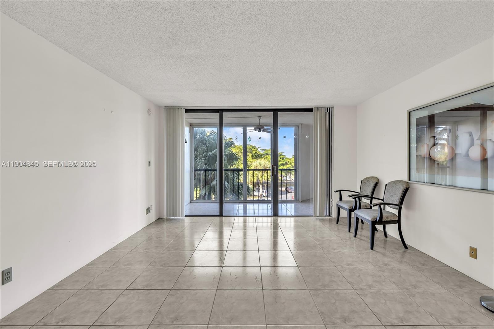 16300 Golf Club Road, Unit 408 Weston, FL 33326 - Photo 15 of 31 a living room with furniture and a large window