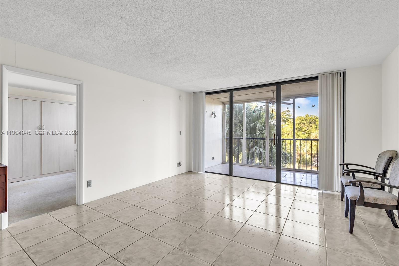 16300 Golf Club Road, Unit 408 Weston, FL 33326 - Photo 16 of 31 a view of an empty room and window