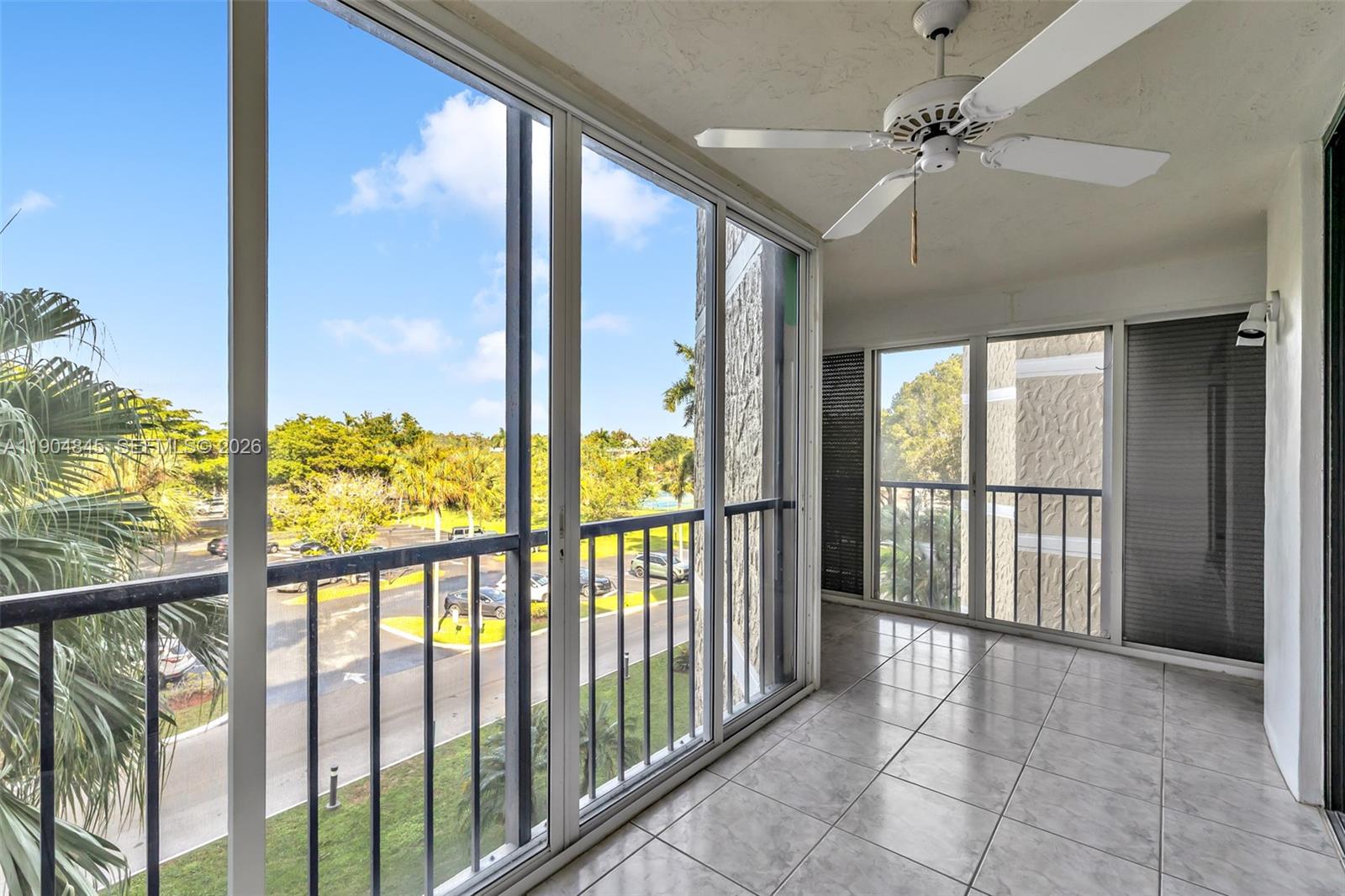 16300 Golf Club Road, Unit 408 Weston, FL 33326 - Photo 17 of 31 a view of hallway with a large window