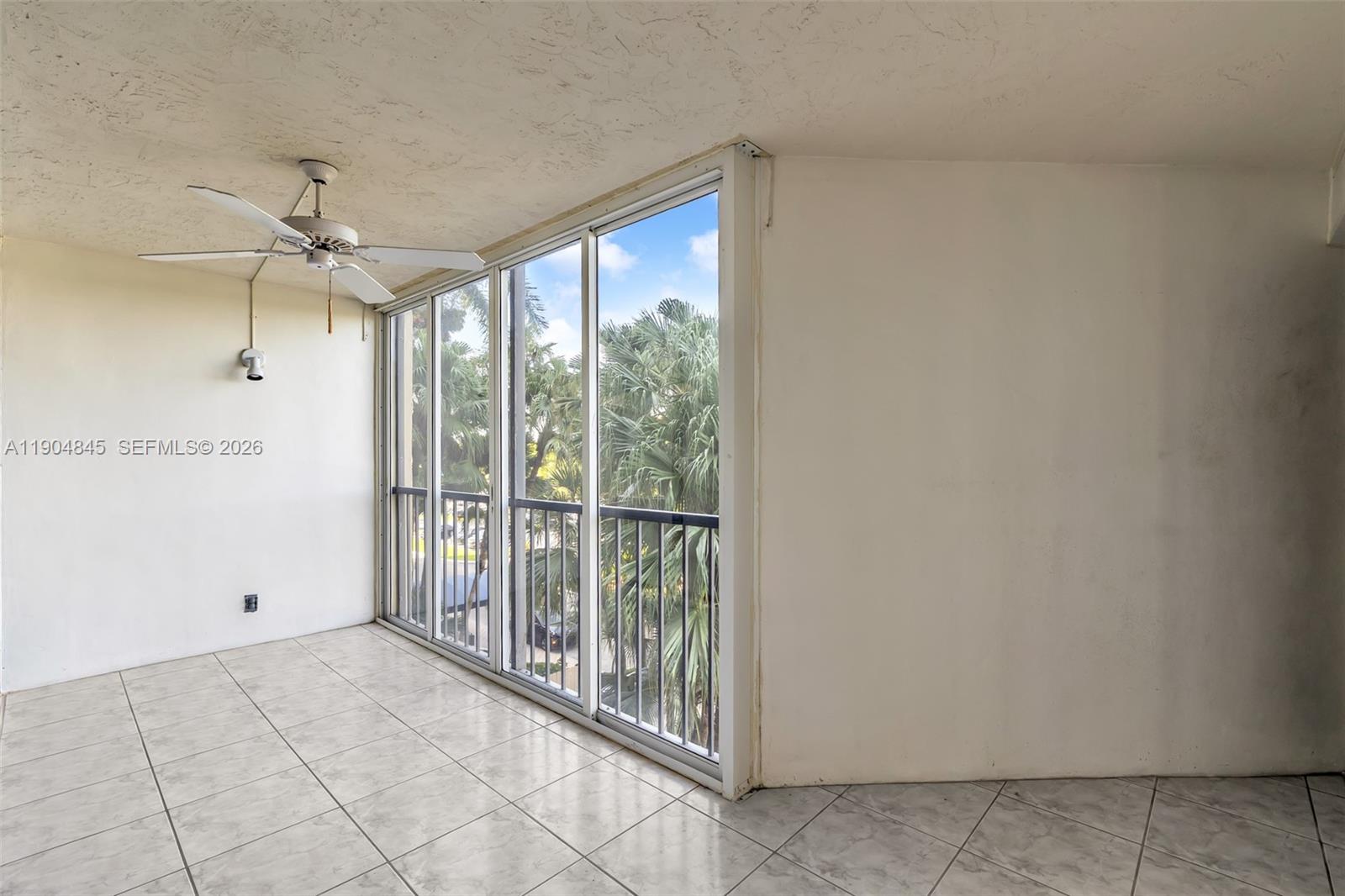 16300 Golf Club Road, Unit 408 Weston, FL 33326 - Photo 18 of 31 a view of an empty room with a window