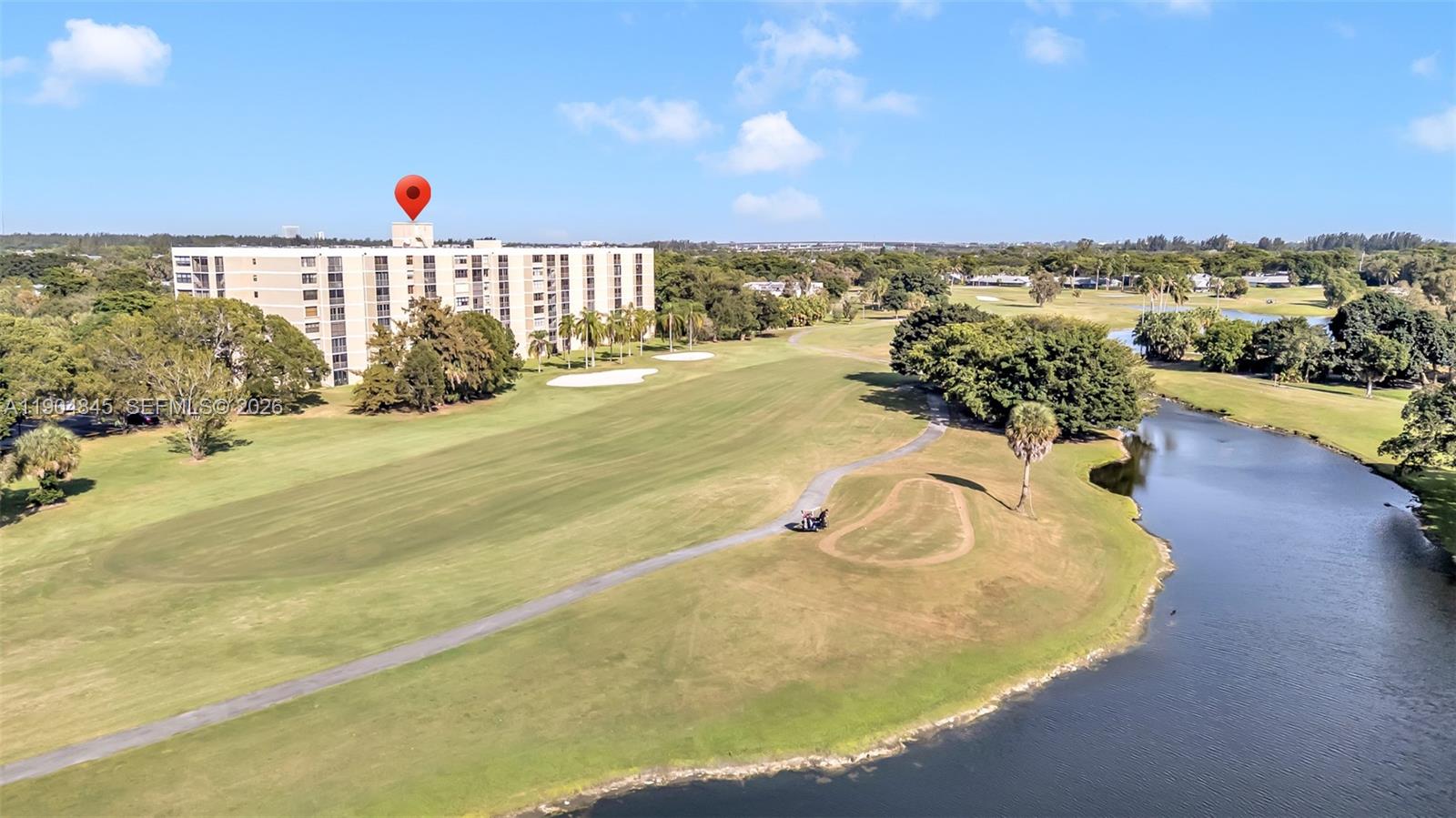16300 Golf Club Road, Unit 408 Weston, FL 33326 - Photo 2 of 31 a view of a swimming pool and an ocean view