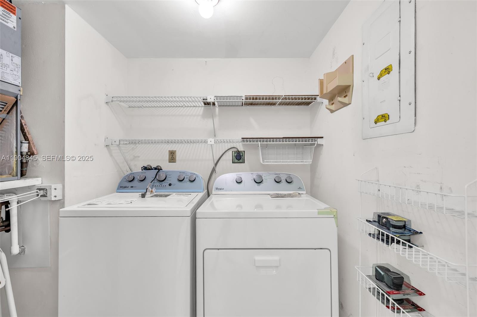 16300 Golf Club Road, Unit 408 Weston, FL 33326 - Photo 23 of 31 a utility room with dryer and washer