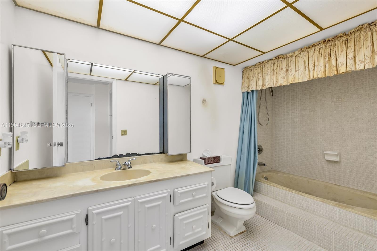 16300 Golf Club Road, Unit 408 Weston, FL 33326 - Photo 26 of 31 a bathroom with a granite countertop sink a toilet and shower