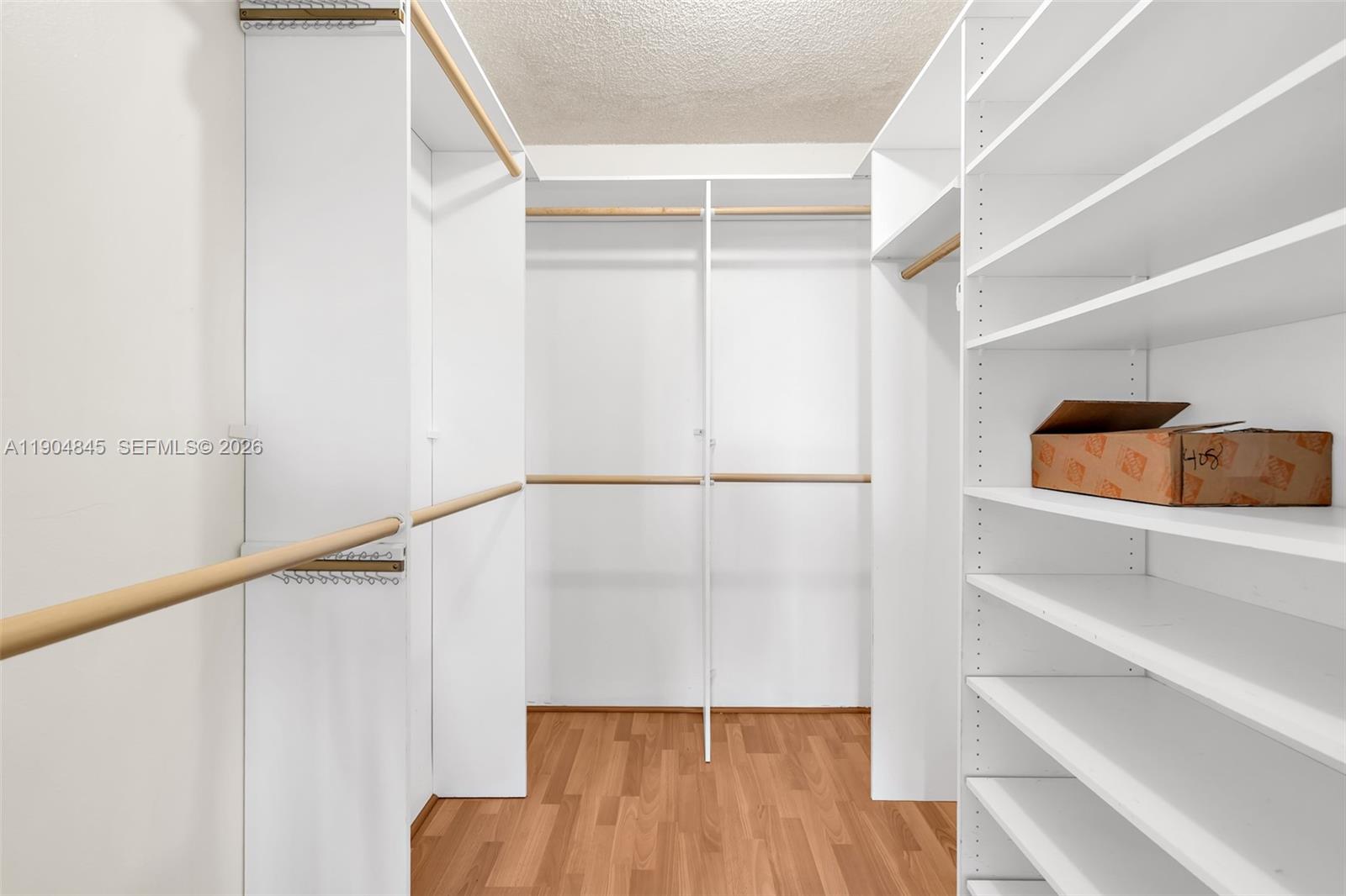 16300 Golf Club Road, Unit 408 Weston, FL 33326 - Photo 27 of 31 a view of walk in closet with empty racks