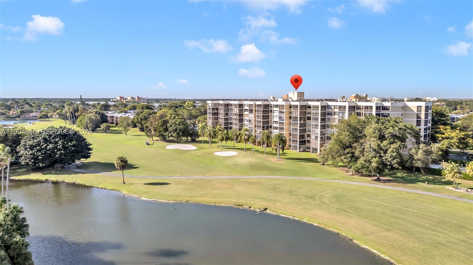 16300 Golf Club Road, Unit 408 Weston, FL 33326 - Photo 4 of 31 a view of a swimming pool and an ocean view