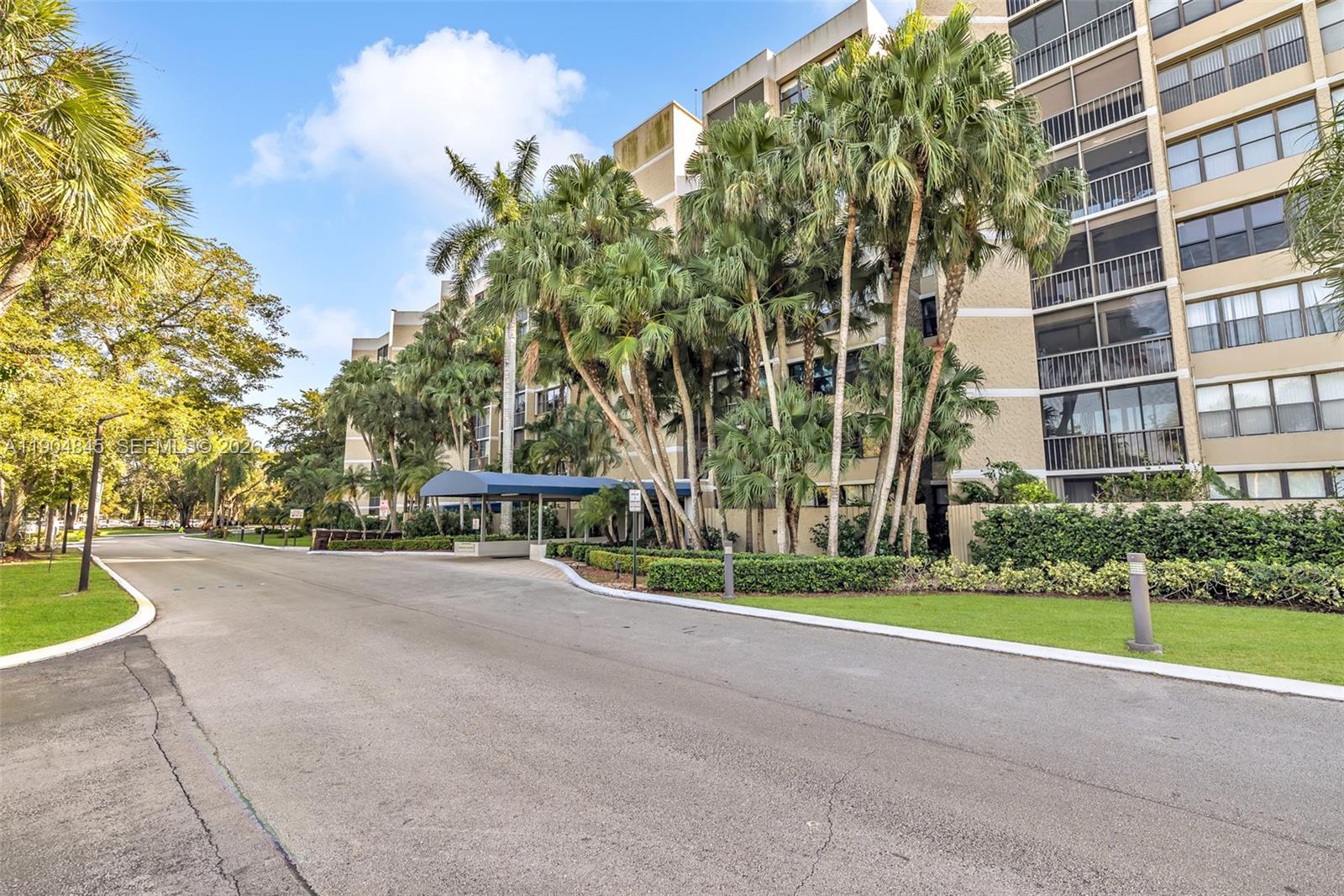 16300 Golf Club Road, Unit 408 Weston, FL 33326 - Photo 7 of 31 a view of a apartment with a large trees