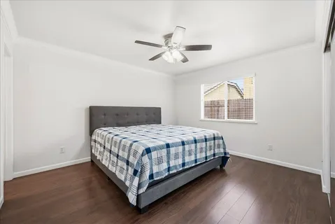 a bedroom with a bed and window