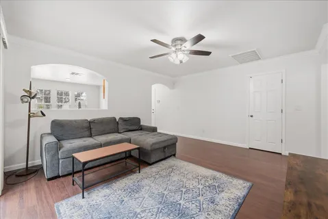 a living room with furniture and a rug