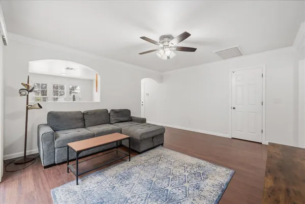 a living room with furniture and a rug