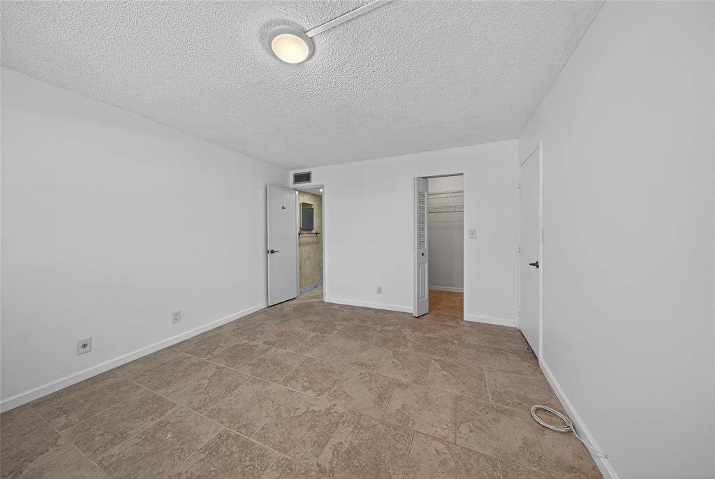 1541 South Ocean Boulevard, Unit 111 Lauderdale-by-the-Sea, FL 33062 - Photo 16 of 35 Walk-in closet