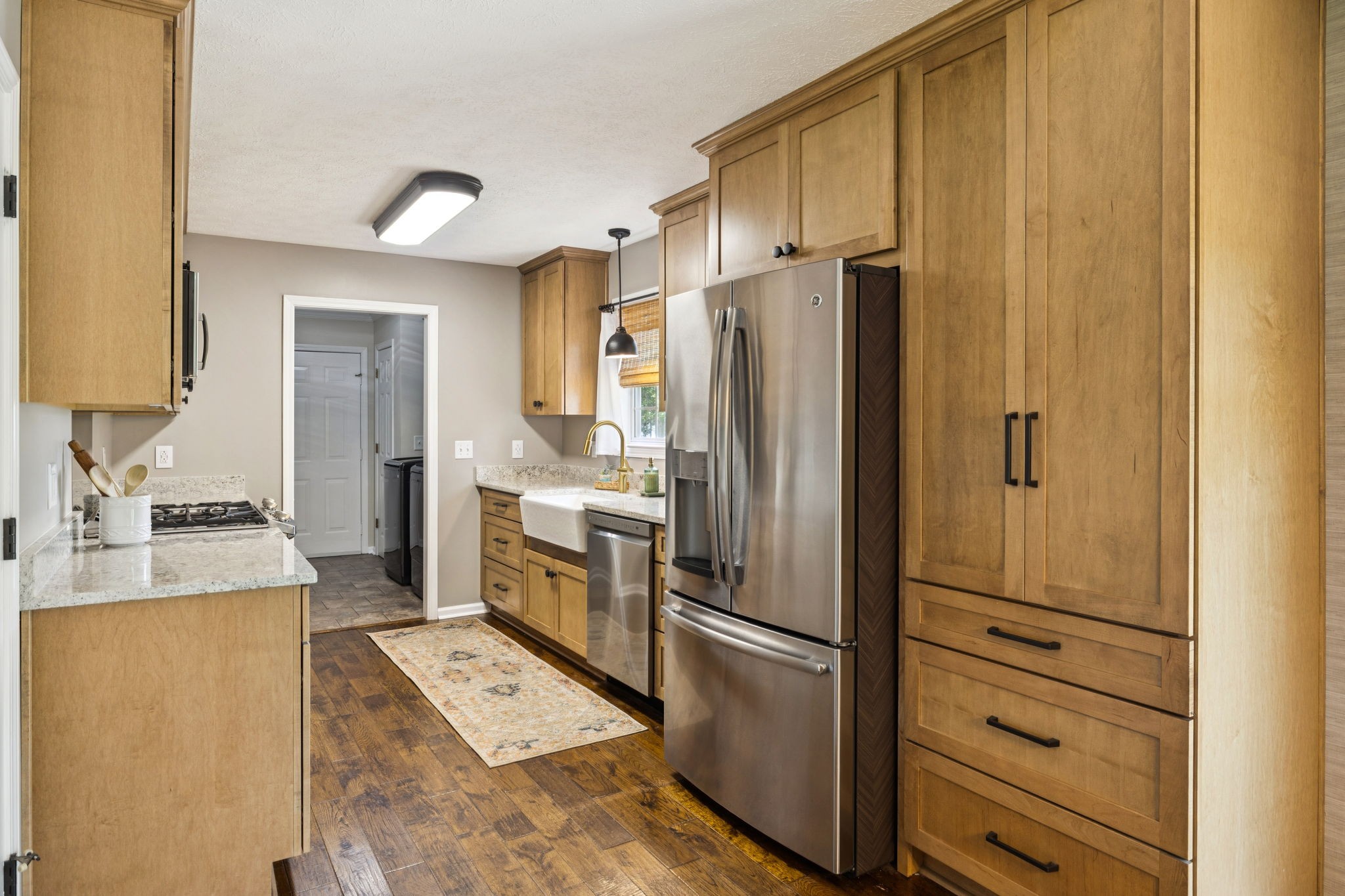 6683 East Benton Road Springfield, TN 37172 - Photo 19 of 64 a kitchen with a refrigerator and a sink