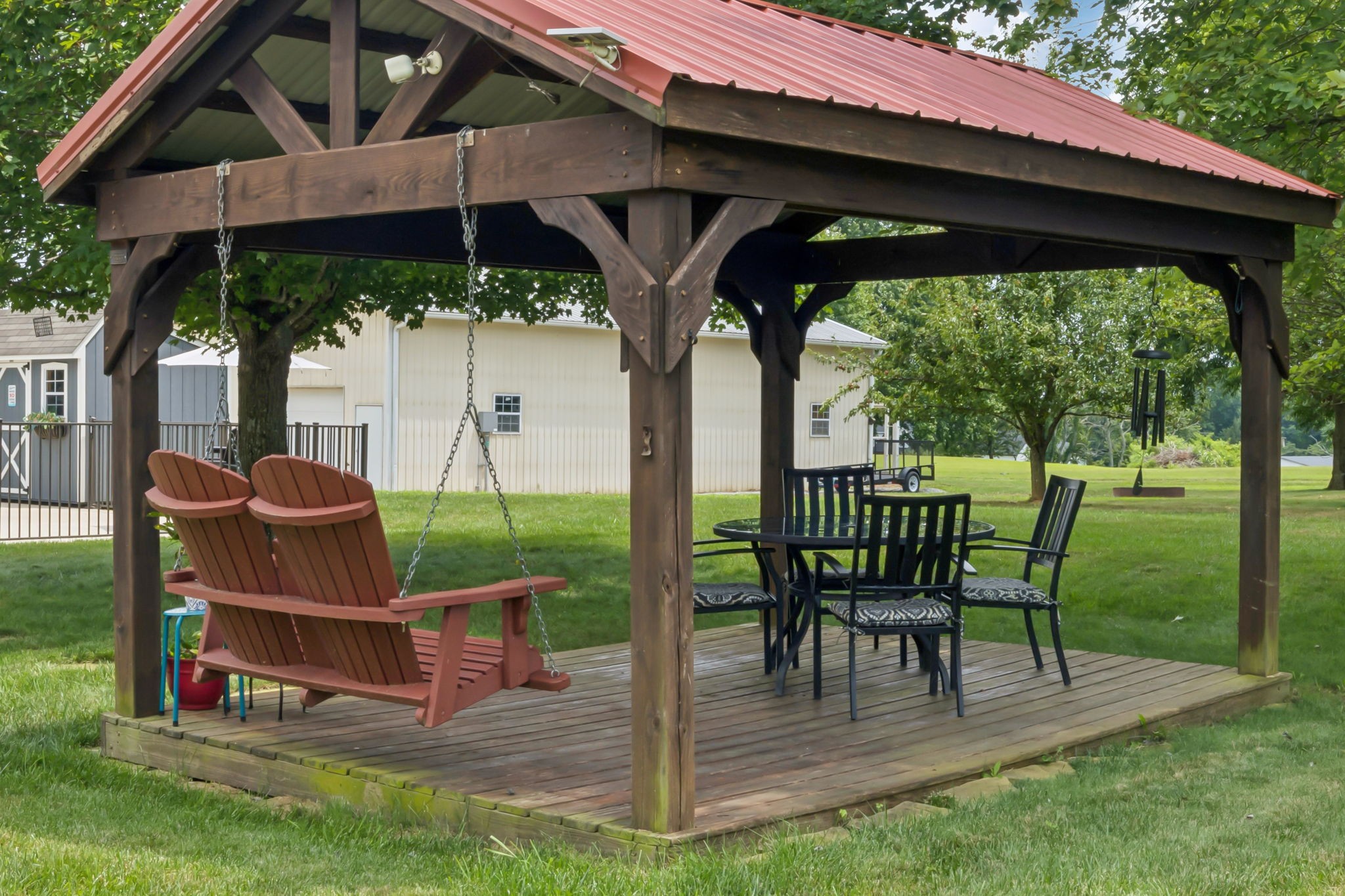 6683 East Benton Road Springfield, TN 37172 - Photo 44 of 64 a view of a patio with table and chairs under an umbrella
