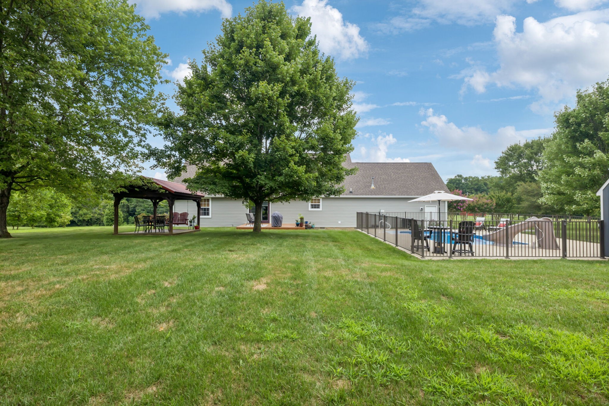 6683 East Benton Road Springfield, TN 37172 - Photo 47 of 64 a view of a house with a big yard plants and large trees