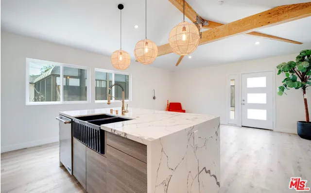 a kitchen that has a stove and a table