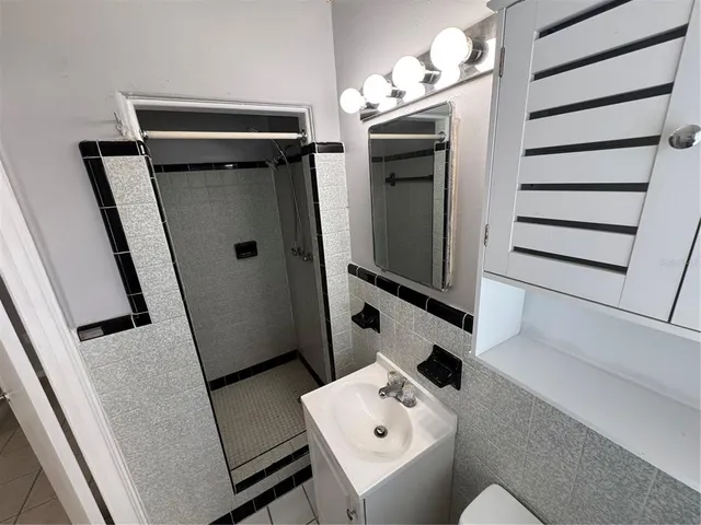 a bathroom with a sink and mirror