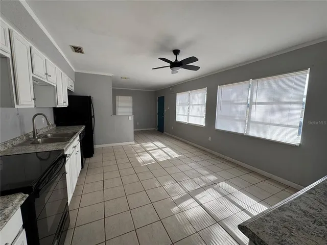 a view of an empty room with a window