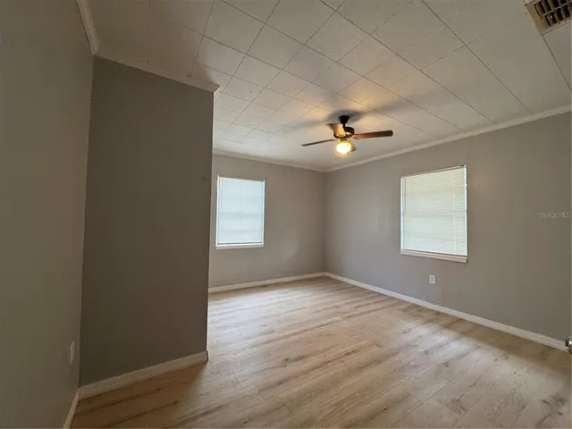 a view of an empty room with a window