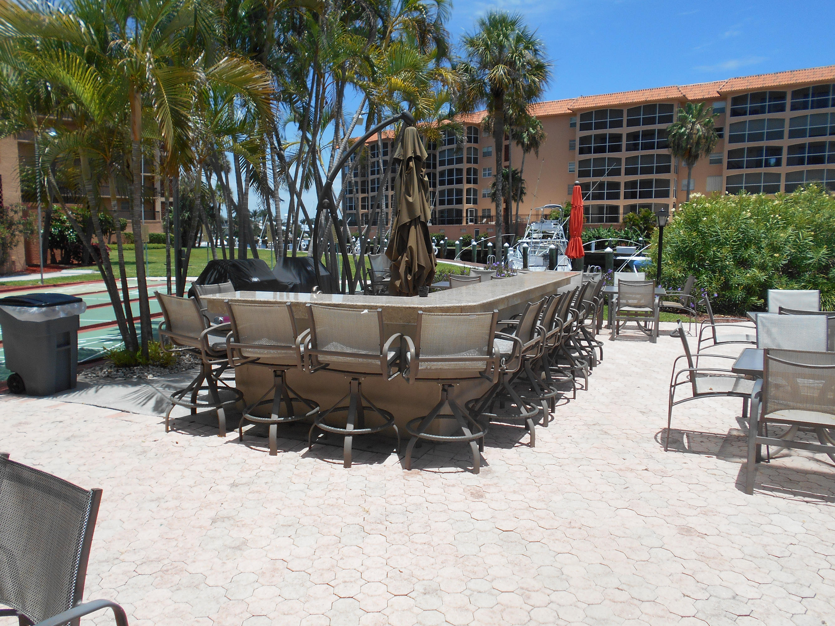2871 North Ocean Boulevard, Unit D220 Boca Raton, FL 33431 - Photo 77 of 133 outdoor_bar_and_bbq_area_adjacent_to_clu