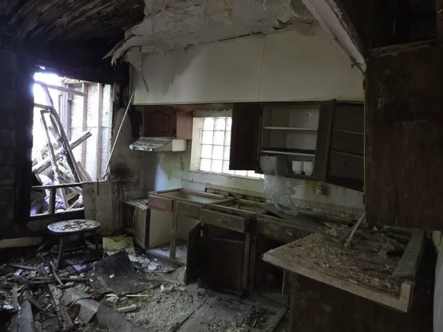 a kitchen with sink and window