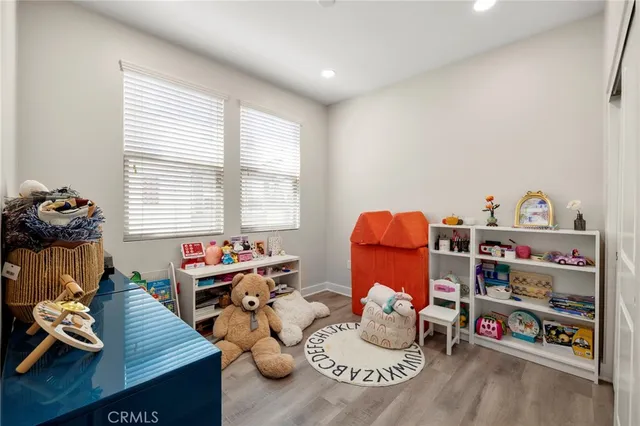 a reading room with furniture toys and a book shelf
