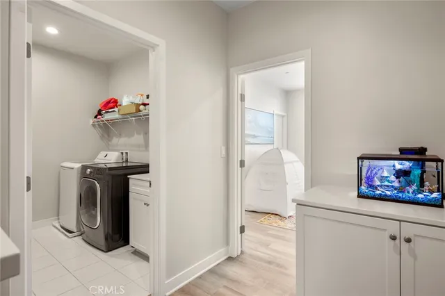a view of a hallway with washer and dryer