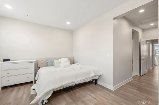 a bedroom with a bed and a dresser