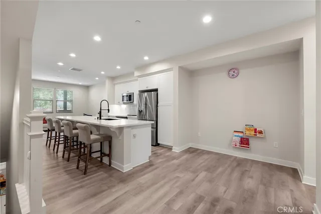 a room with furniture and wooden floor