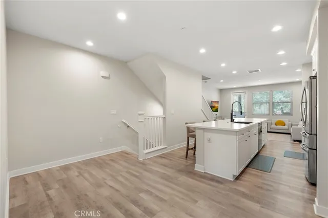 a view of kitchen with cabinets and wooden floor