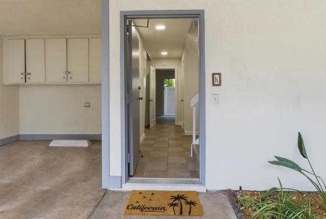 a view of a hallway with a room