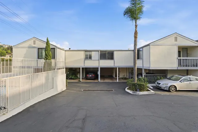 a view of a house with swimming pool and sitting area