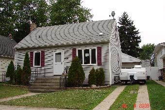 17614 Community Street Lansing, IL 60438 - Photo 1 of 1 a front view of a house with a garden