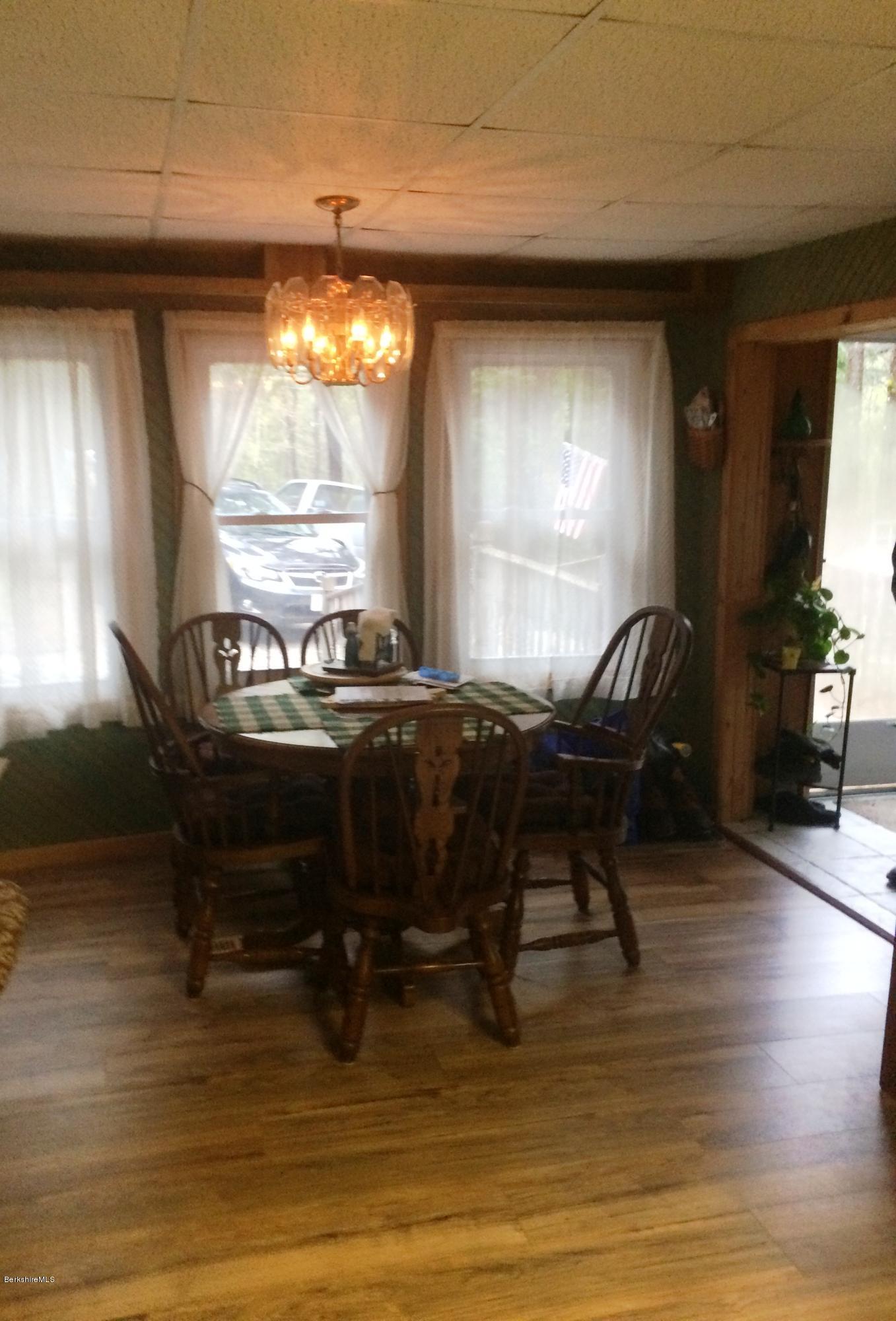 2-35 759 North Main Road Otis, MA 01253 - Photo 14 of 24 a living room with furniture a window and a table