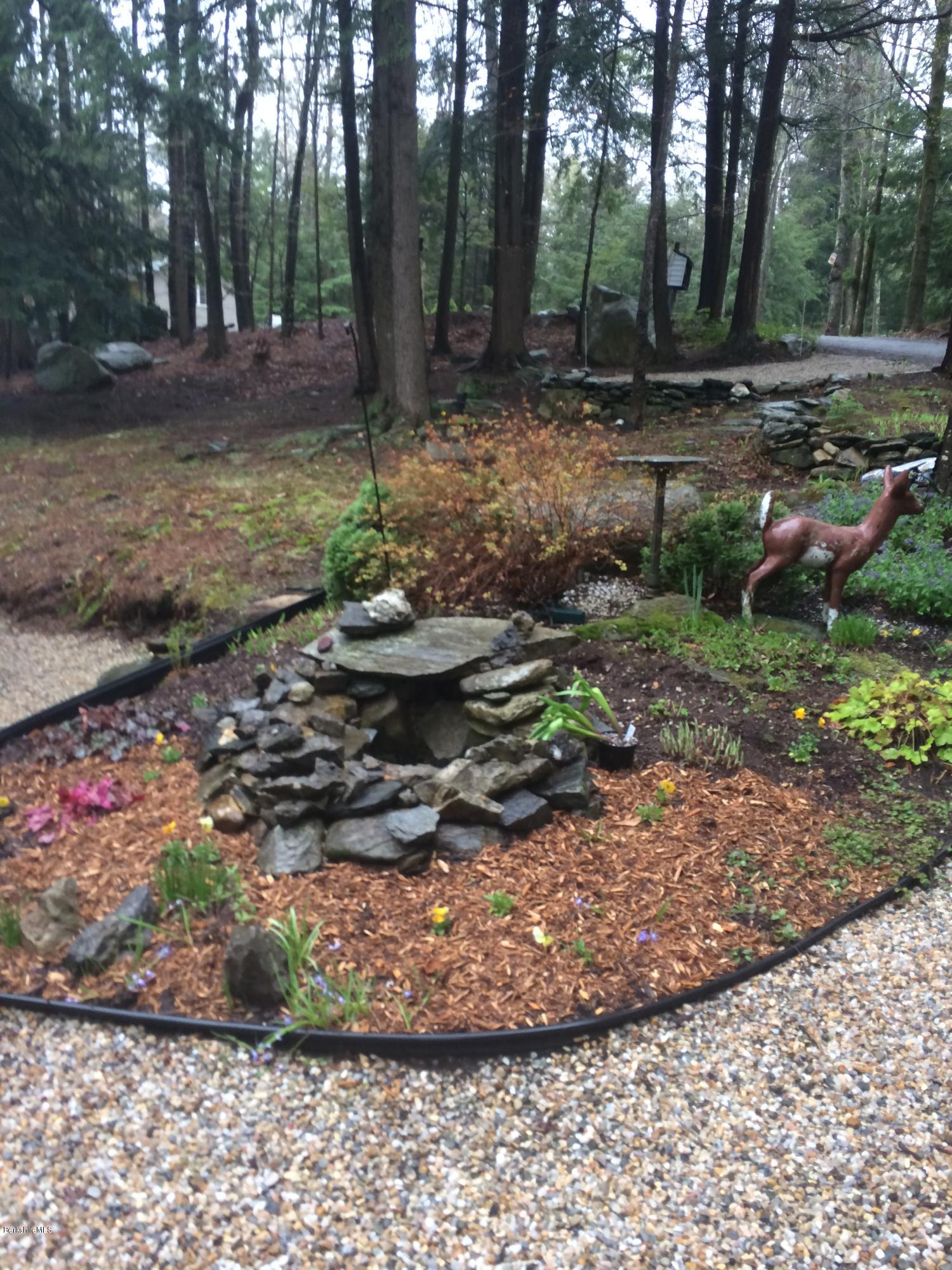 2-35 759 North Main Road Otis, MA 01253 - Photo 4 of 24 a view of a garden with large trees