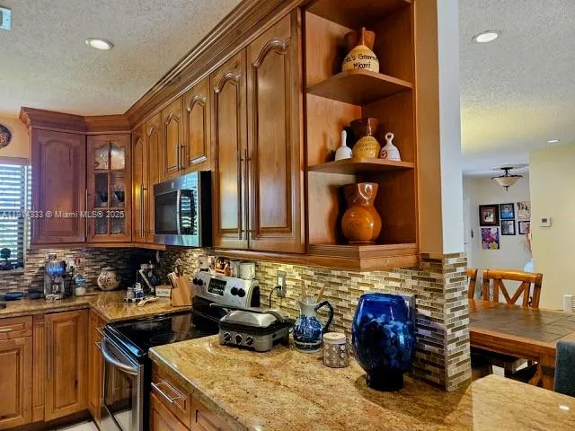 a kitchen with a stove and a sink