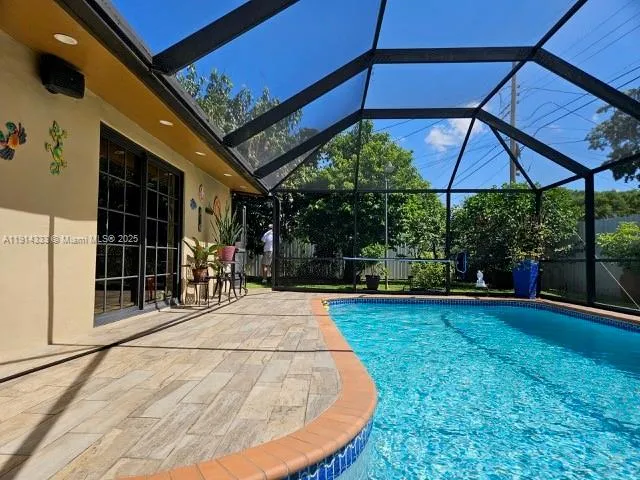 a view of a backyard with a sink and wooden floor
