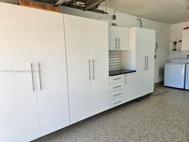 a view of walk in closet with cabinet