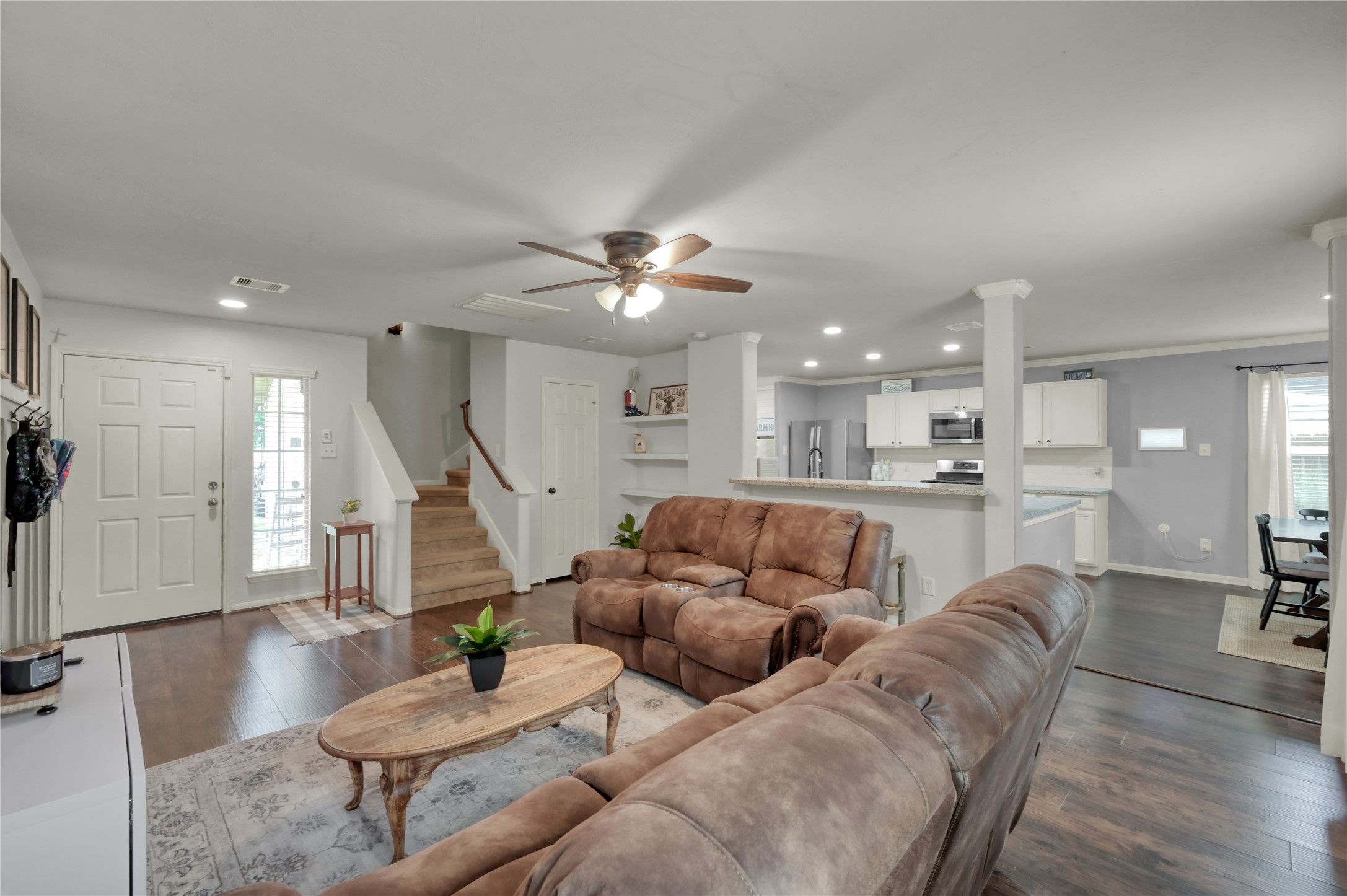21610 Falvel Misty Drive Spring, TX 77388 - Photo 5 of 28 From the kitchen to the living room—easy flow and upgraded luxury vinyl flooring