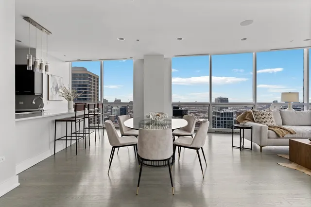 a view of a dining room with furniture window and outside view