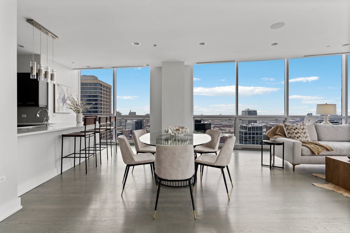 110 West Superior Street, Unit 2503 Chicago, IL 60654 - Photo 12 of 34 a view of a dining room with furniture window and outside view