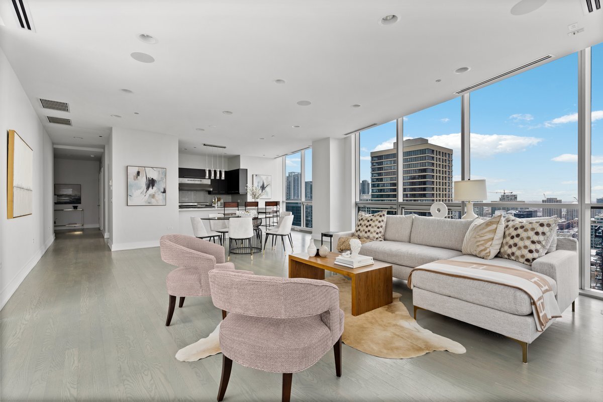 110 West Superior Street, Unit 2503 Chicago, IL 60654 - Photo 13 of 34 a living room with furniture kitchen view and a large window