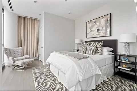 a bedroom with double bed and a window