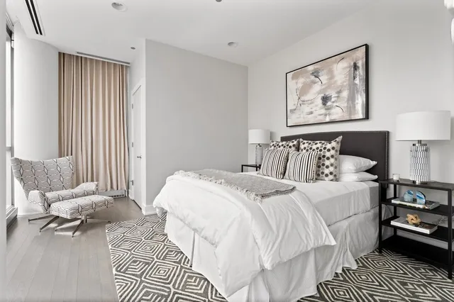 a bedroom with double bed and a window