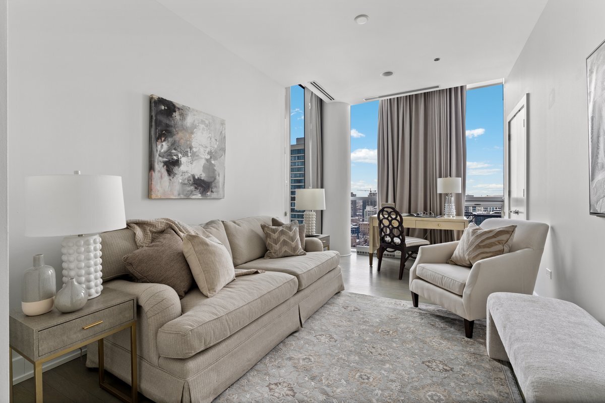 110 West Superior Street, Unit 2503 Chicago, IL 60654 - Photo 24 of 34 a living room with furniture and a large window