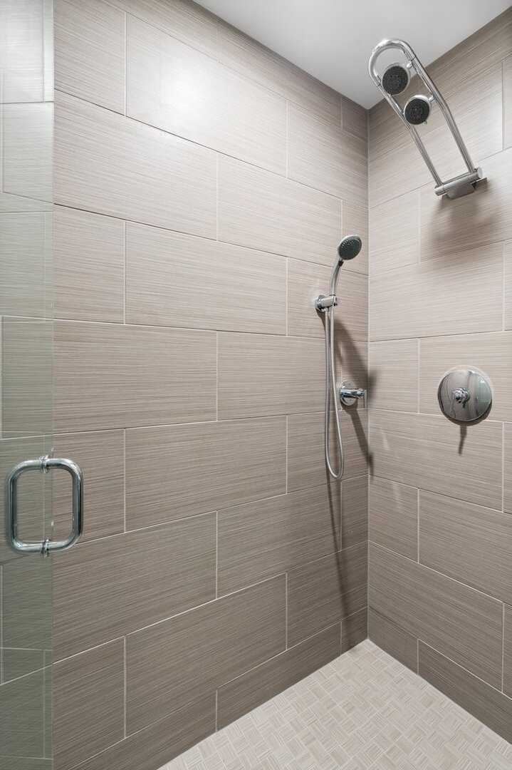 110 West Superior Street, Unit 2503 Chicago, IL 60654 - Photo 26 of 34 a bathroom with a shower