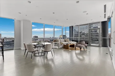a view of a patio with table and chairs